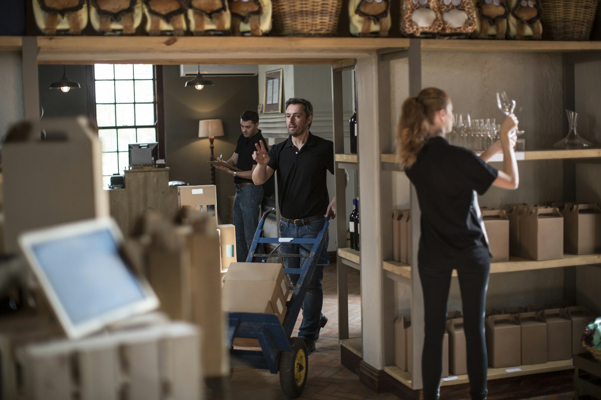 Staff working in wine shop