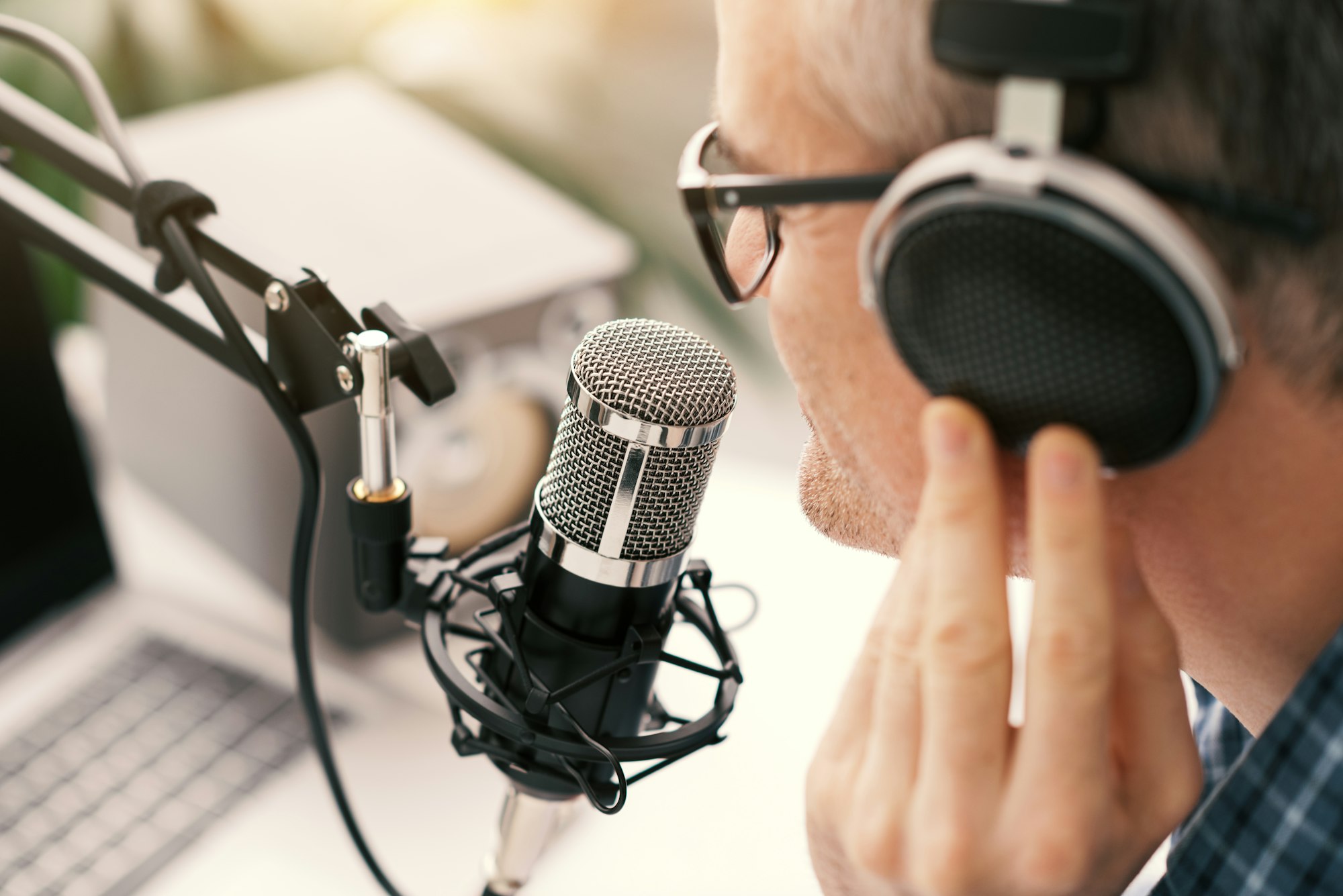 Professional speaker recording a live podcast