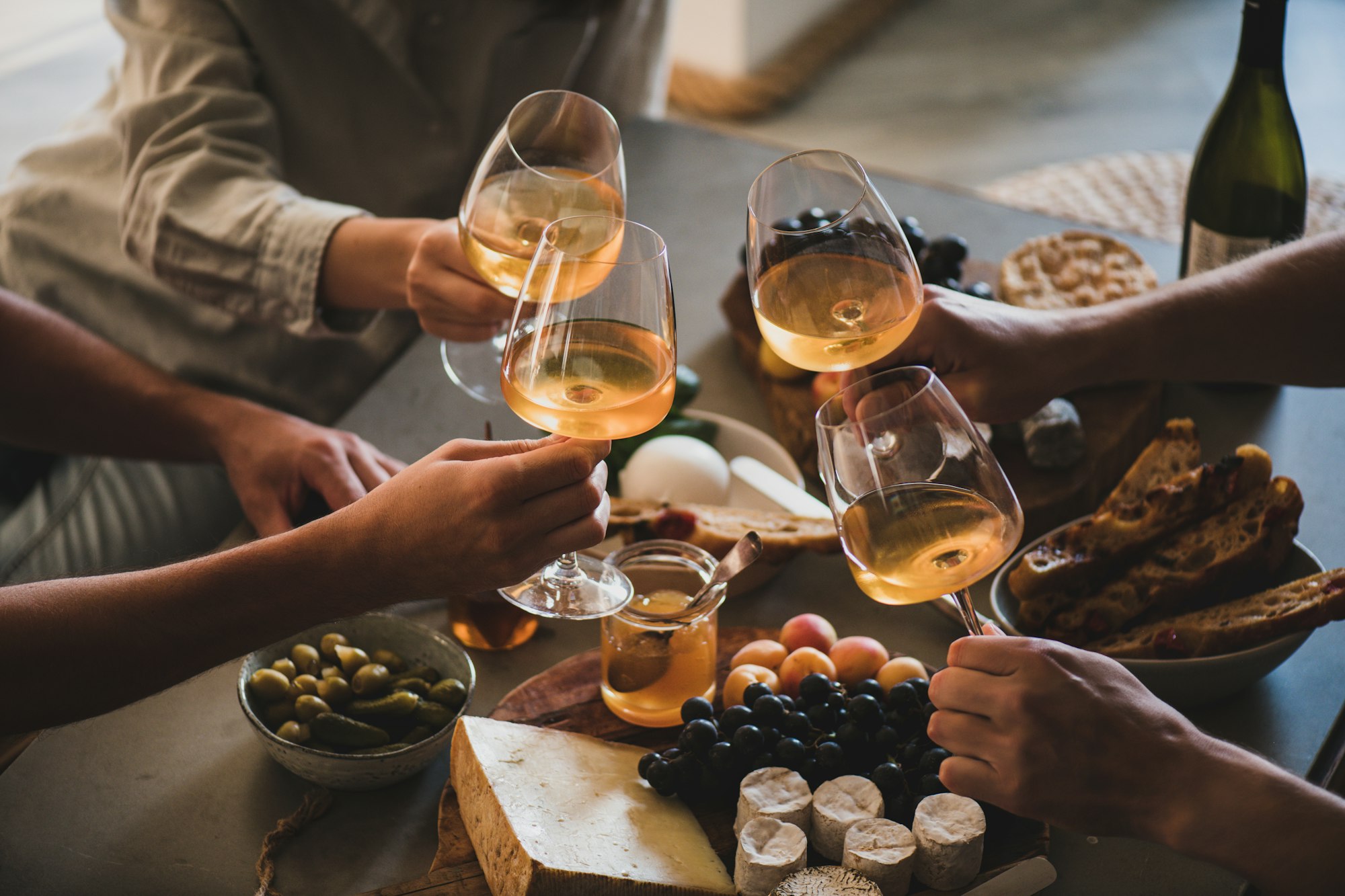 Friends having wine tasting or celebrating event with wine Friends having wine tasting or celebrating event with wine