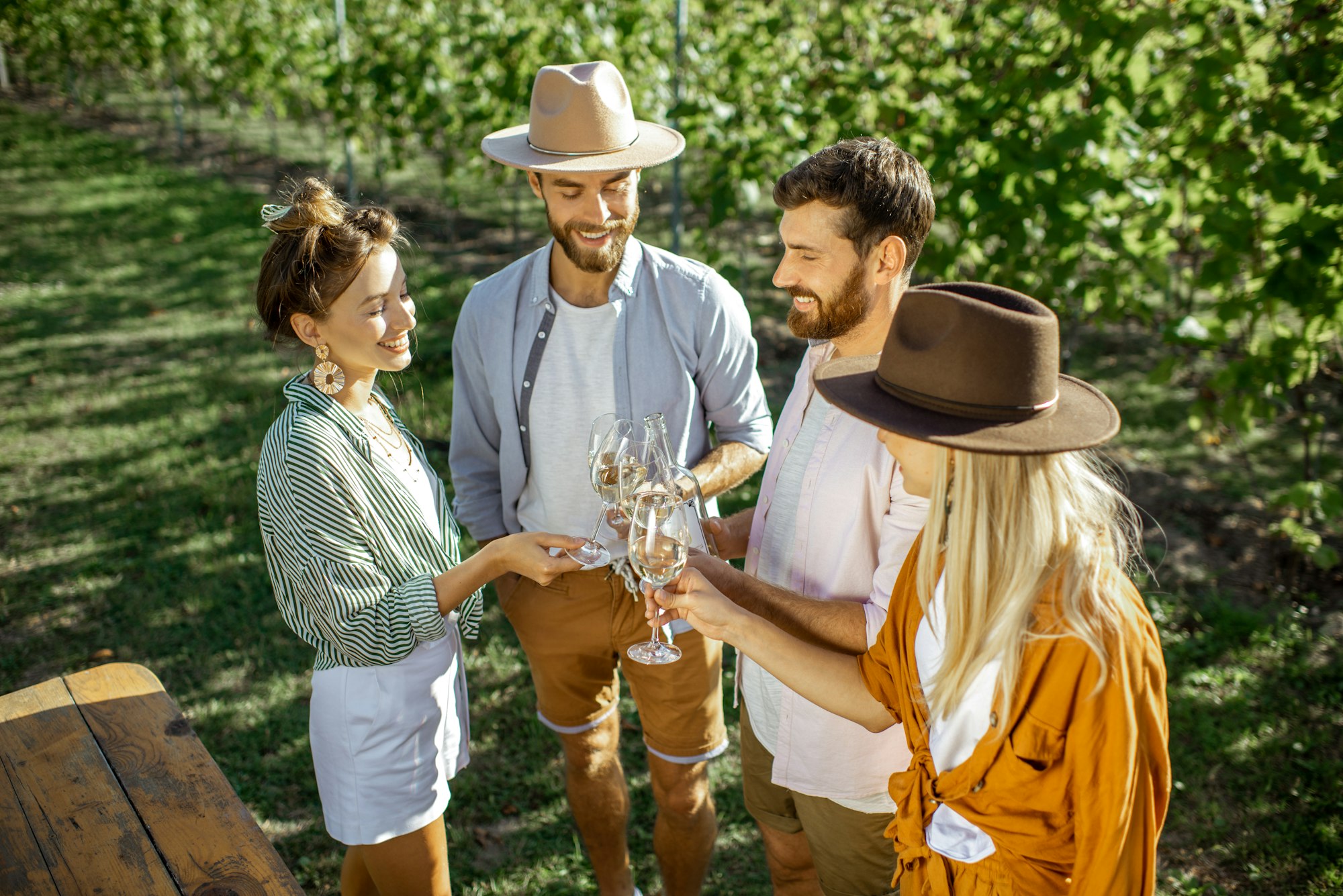 Friends tasting wine on the vineyard
