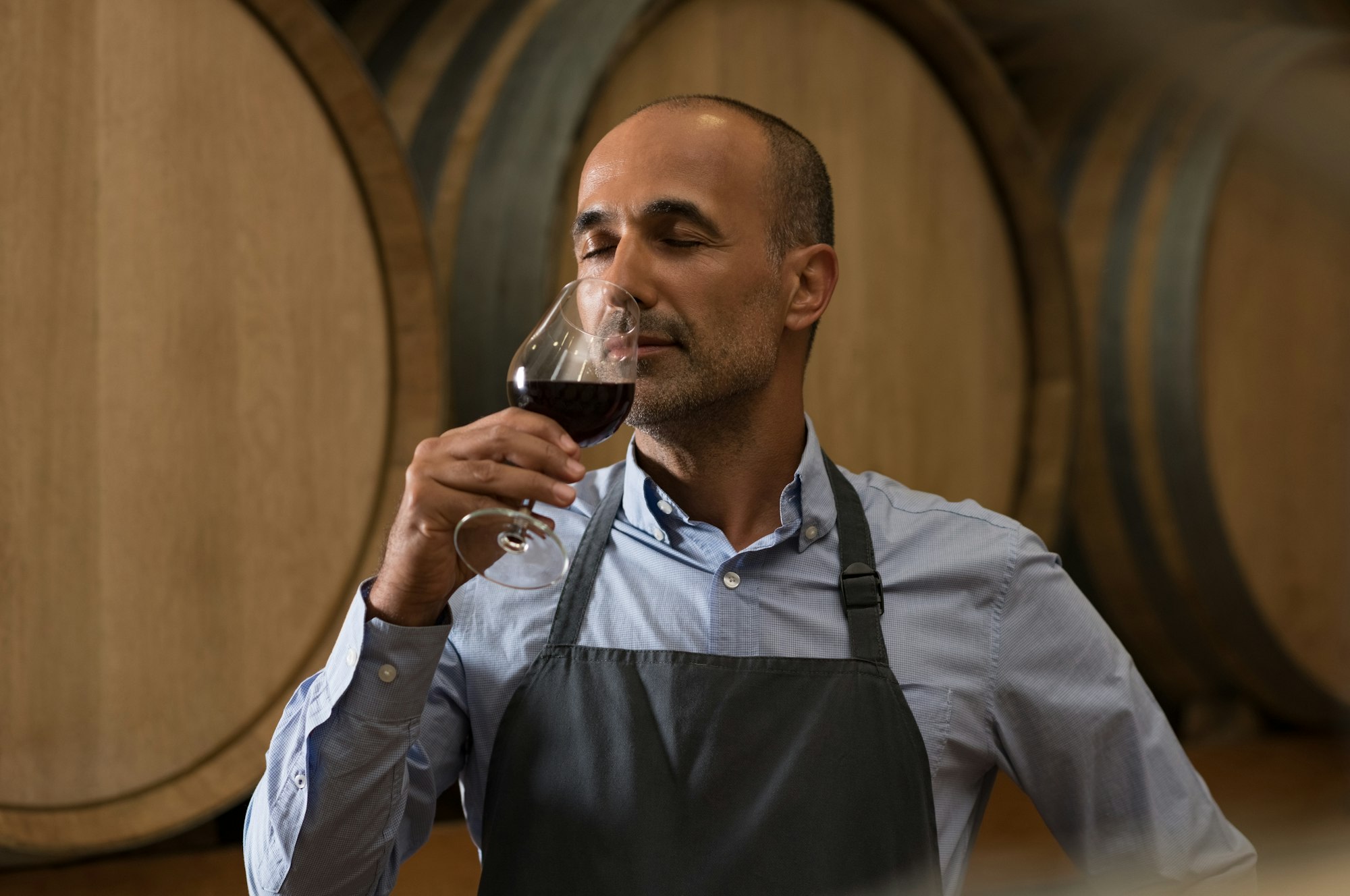 Winemaker tasting wine Winemaker tasting wine